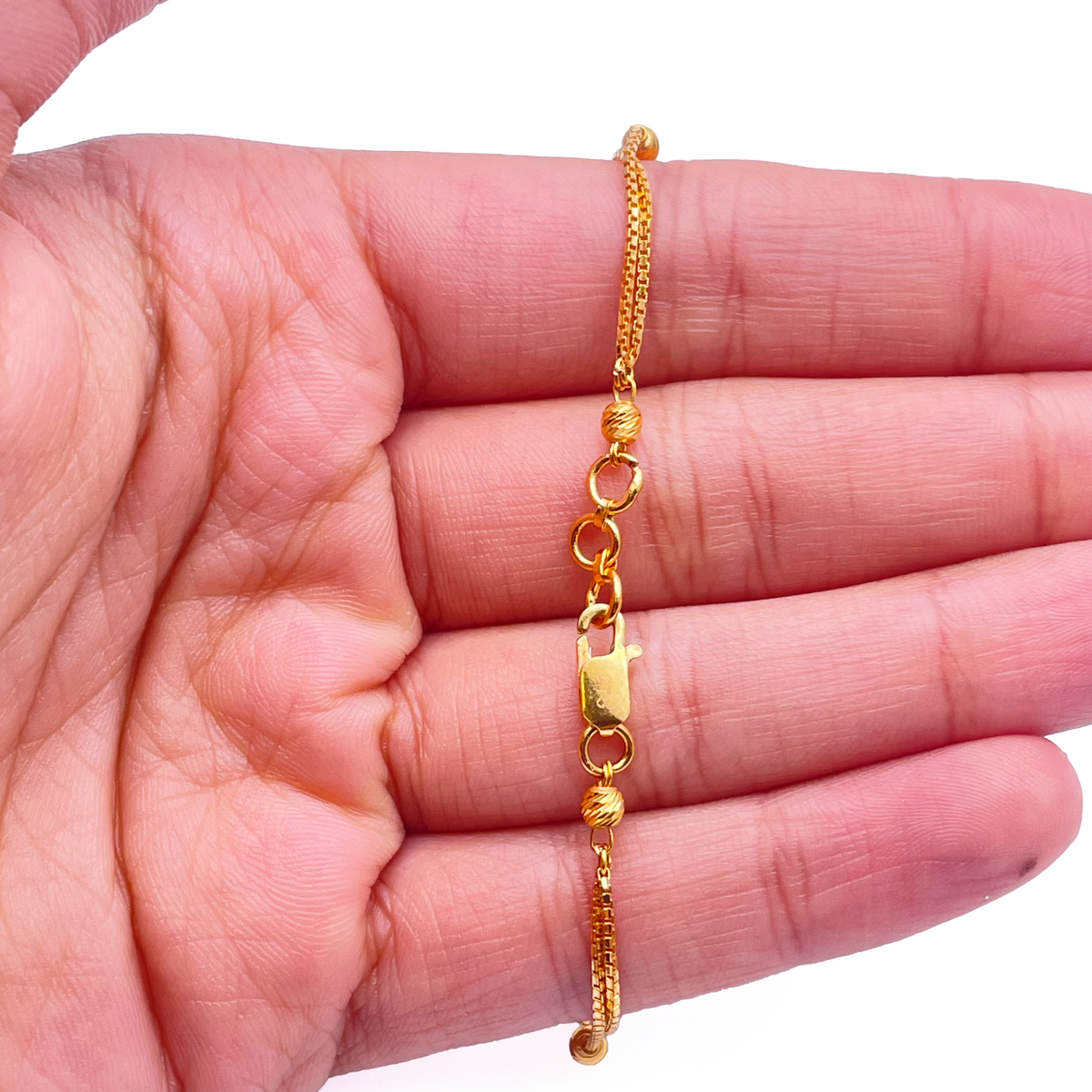22kt gult guld dobbeltlags kæde med diamant-slebne perler armbånd