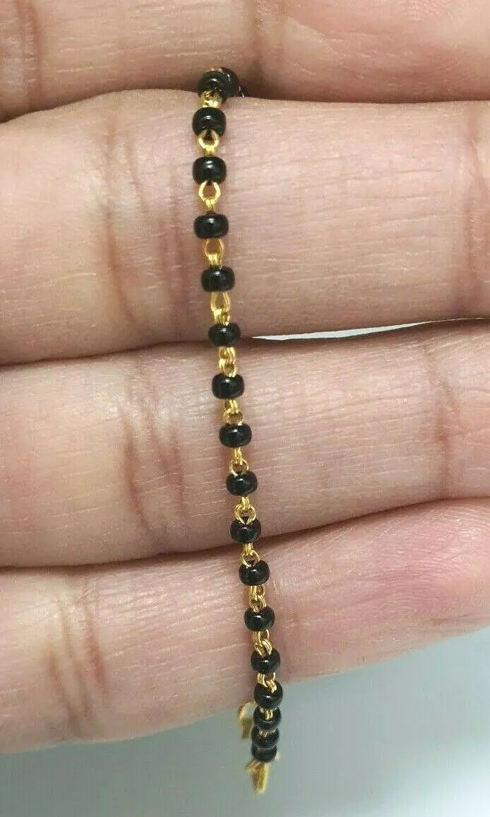 18ct Yellow Gold Baby Bracelet Black Beaded With Diamond Cut Design 