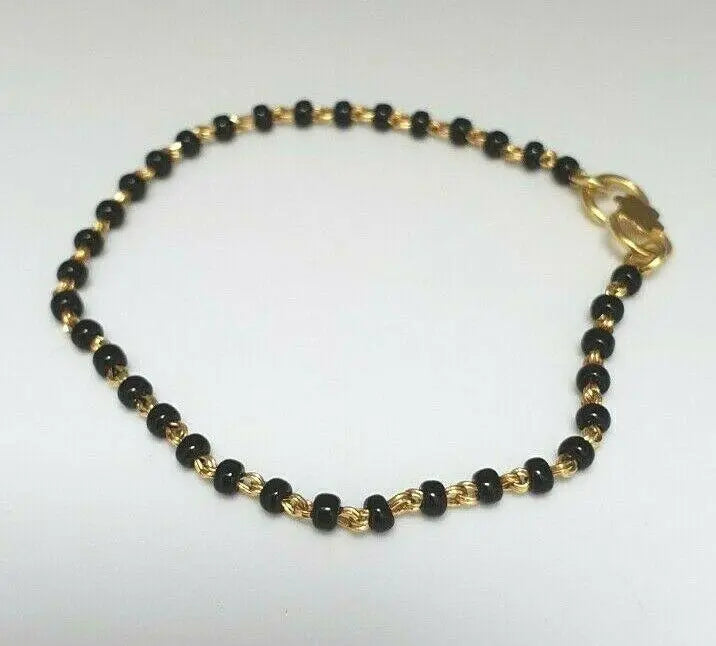 18ct Yellow Gold Baby Bracelet Black Beaded With Diamond Cut Design 