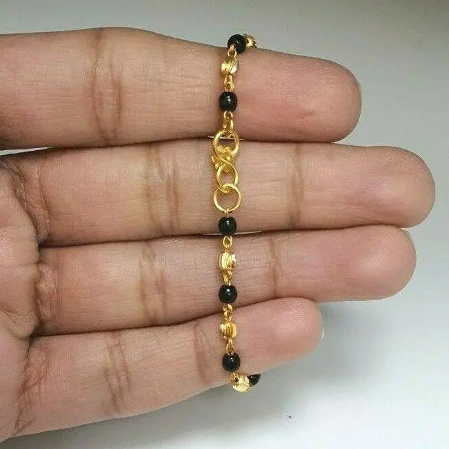 22ct Yellow Gold Baby Bracelet Black-beads With Diamond Cut Design 
