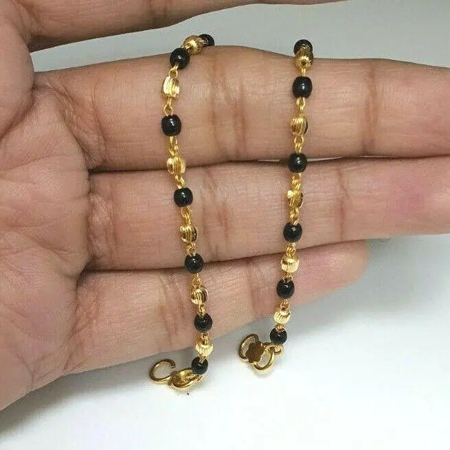 22ct Yellow Gold Baby Bracelet Black-beads With Diamond Cut Design 