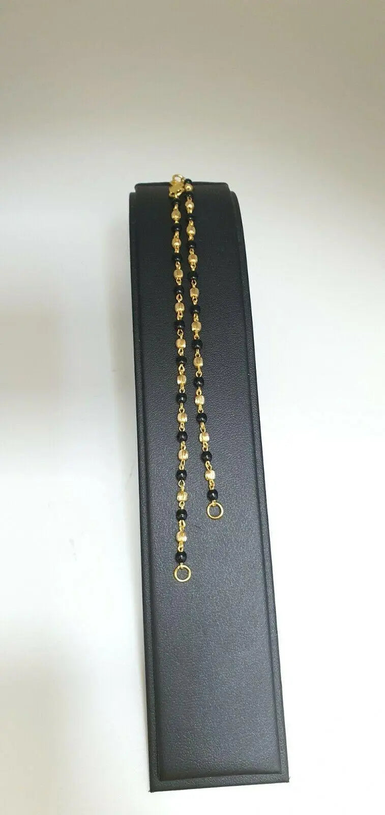 22ct Yellow Gold Baby Bracelet Black-beads With Diamond Cut Design 